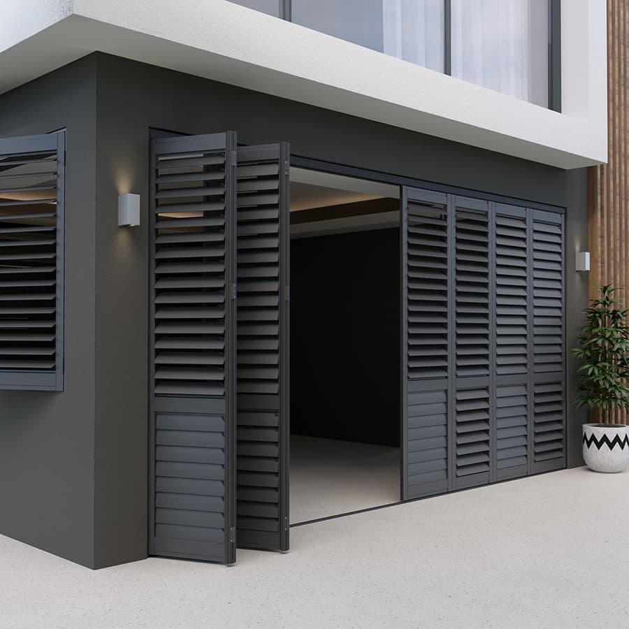 Dark TWO exterior aluminum shutters with folding panels on a modern home